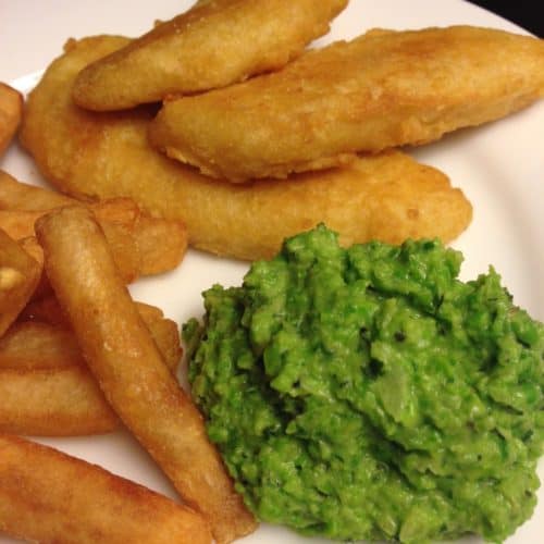 Mushy peas with fish and chips - closeup