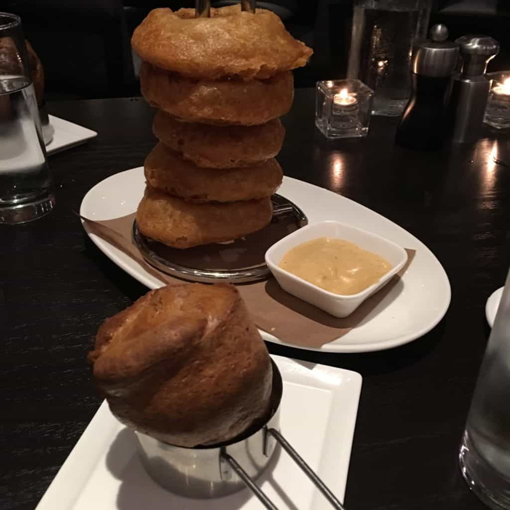 Stack of onion rings and individual popover