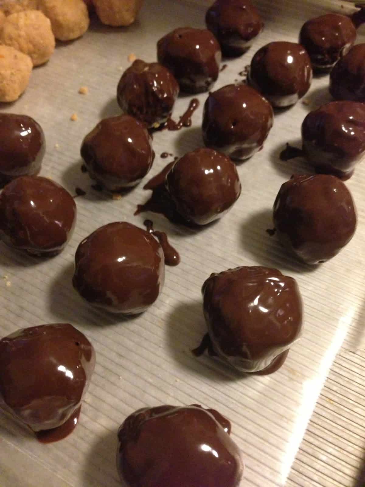 Buckeye Balls drying after being dipped in chocolate
