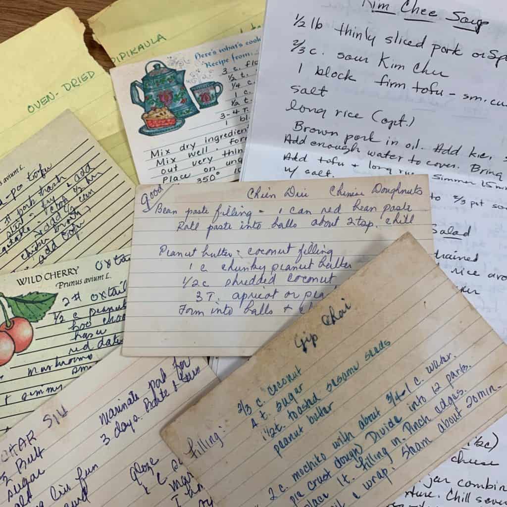 A pile of recipes written on paper and recipe cards