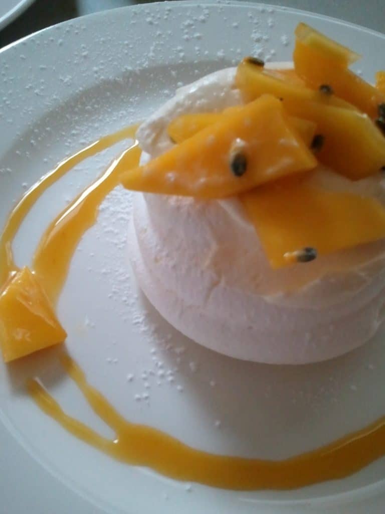 Pavlova with mango and passion fruit