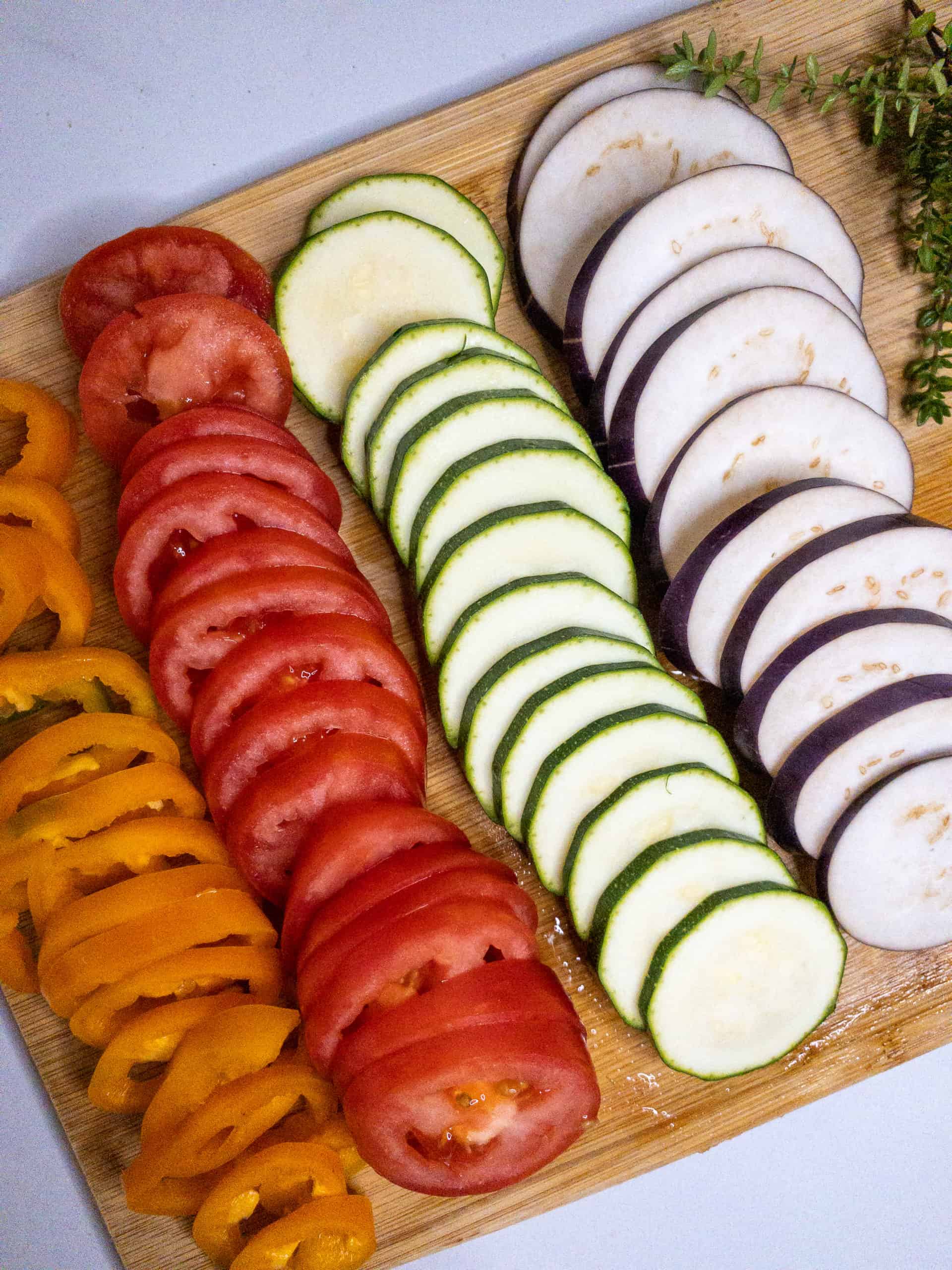 Vegetable slices laid out on a cutting board