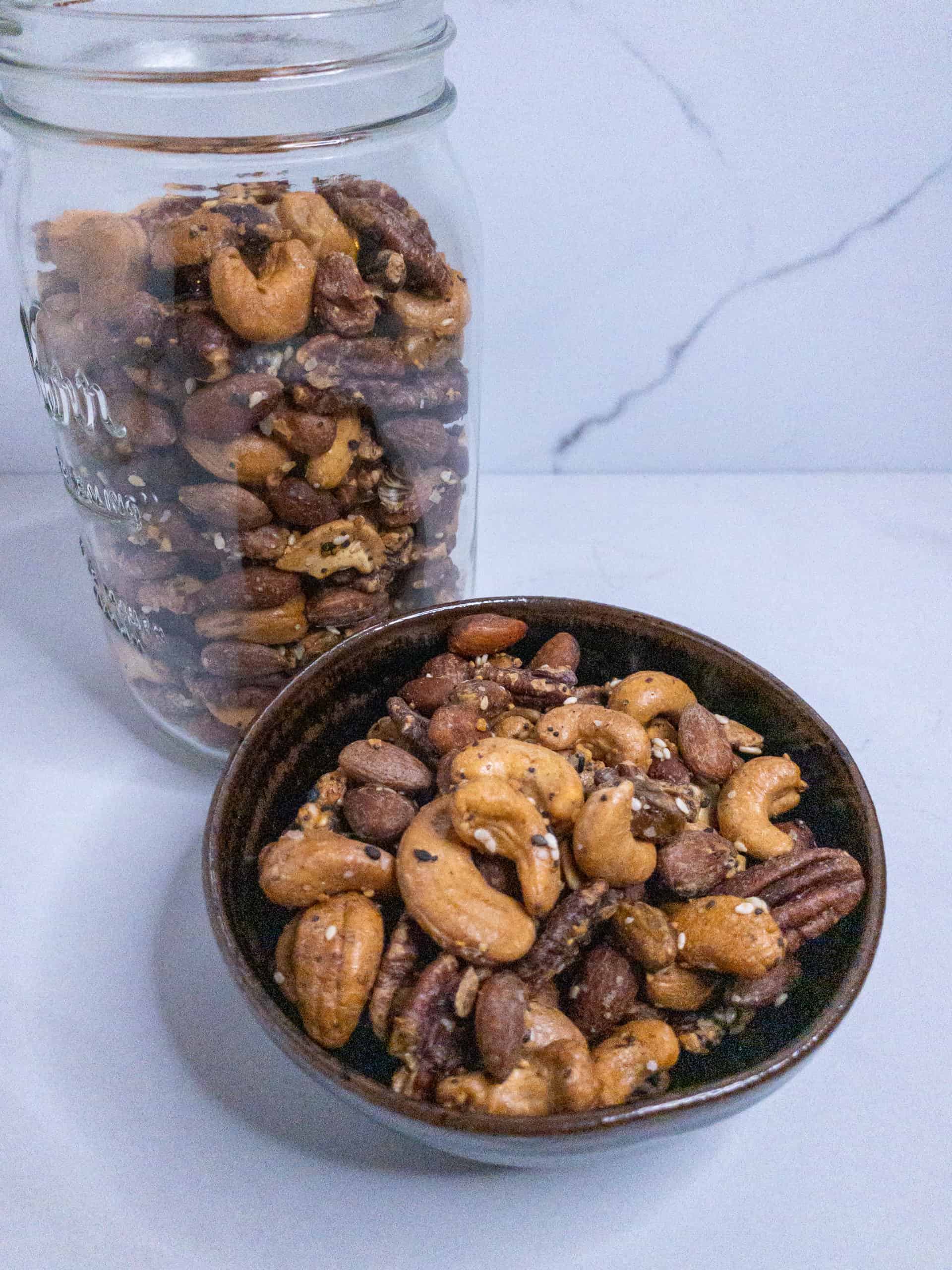 Everything spiced nuts in a jar and in a bowl