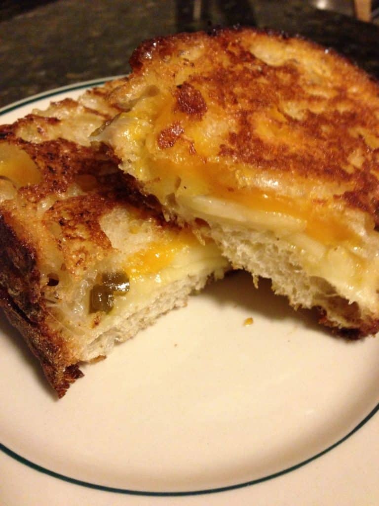 grilled cheese sandwich with pepper jack, sharp cheddar, and peach jalapeño jam on sourdough