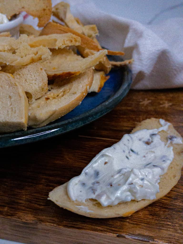 Bagel toast with olive and rosemary cream cheese spread