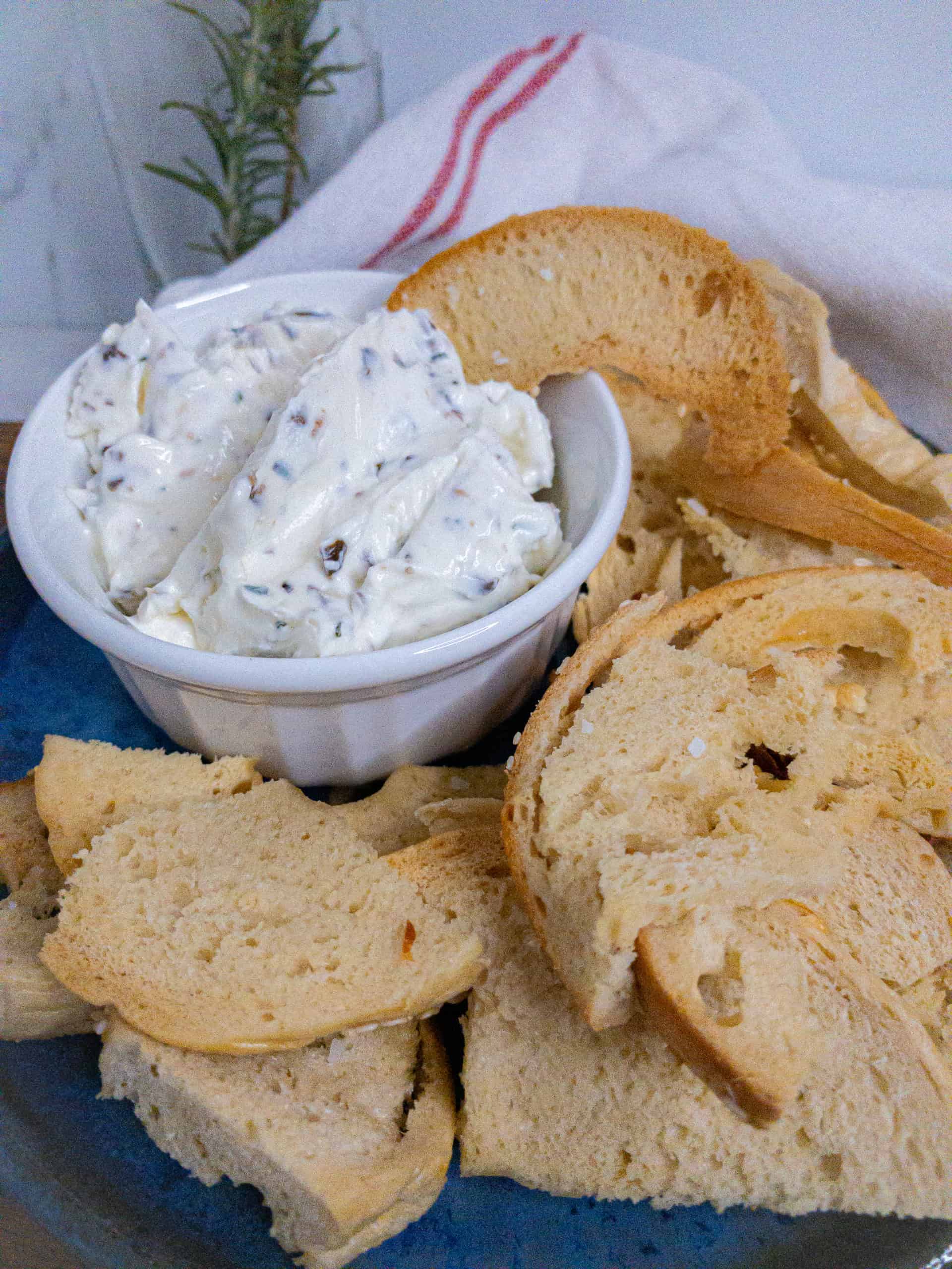 Olive and rosemary cream cheese spread with bagel chips