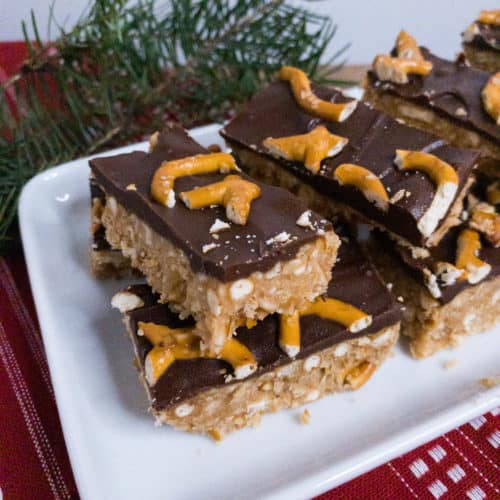 Peanut Butter Pretzel Bars stacked on a serving dish