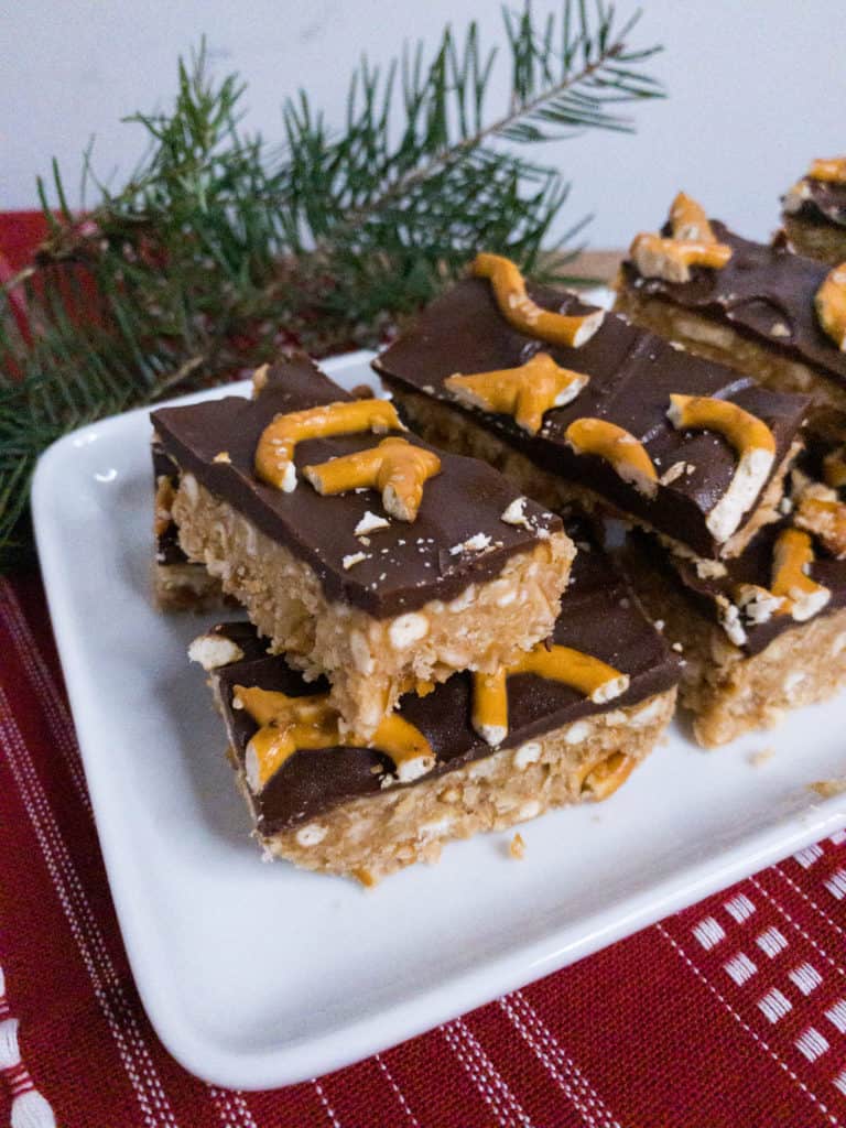 Peanut Butter Pretzel Bars stacked on a serving dish