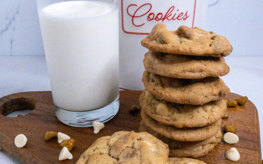 Stack of cookies, glass of milk, and cookie jar