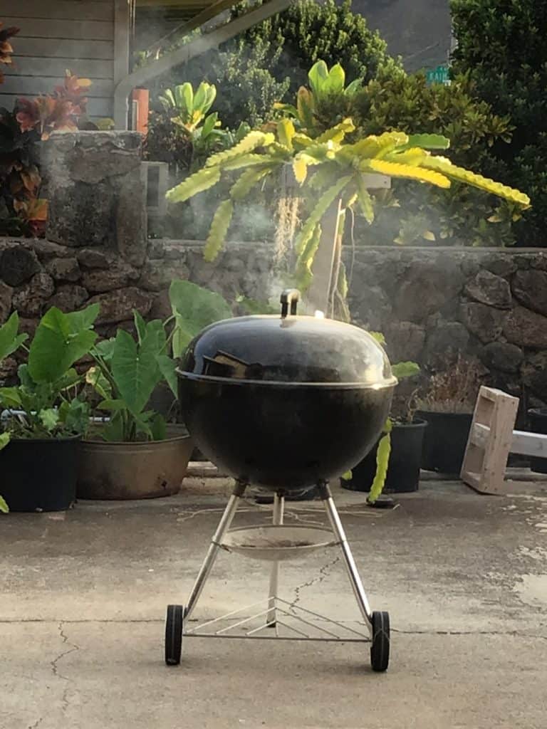 Smoke emanating from the grill when cooking huli huli chicken